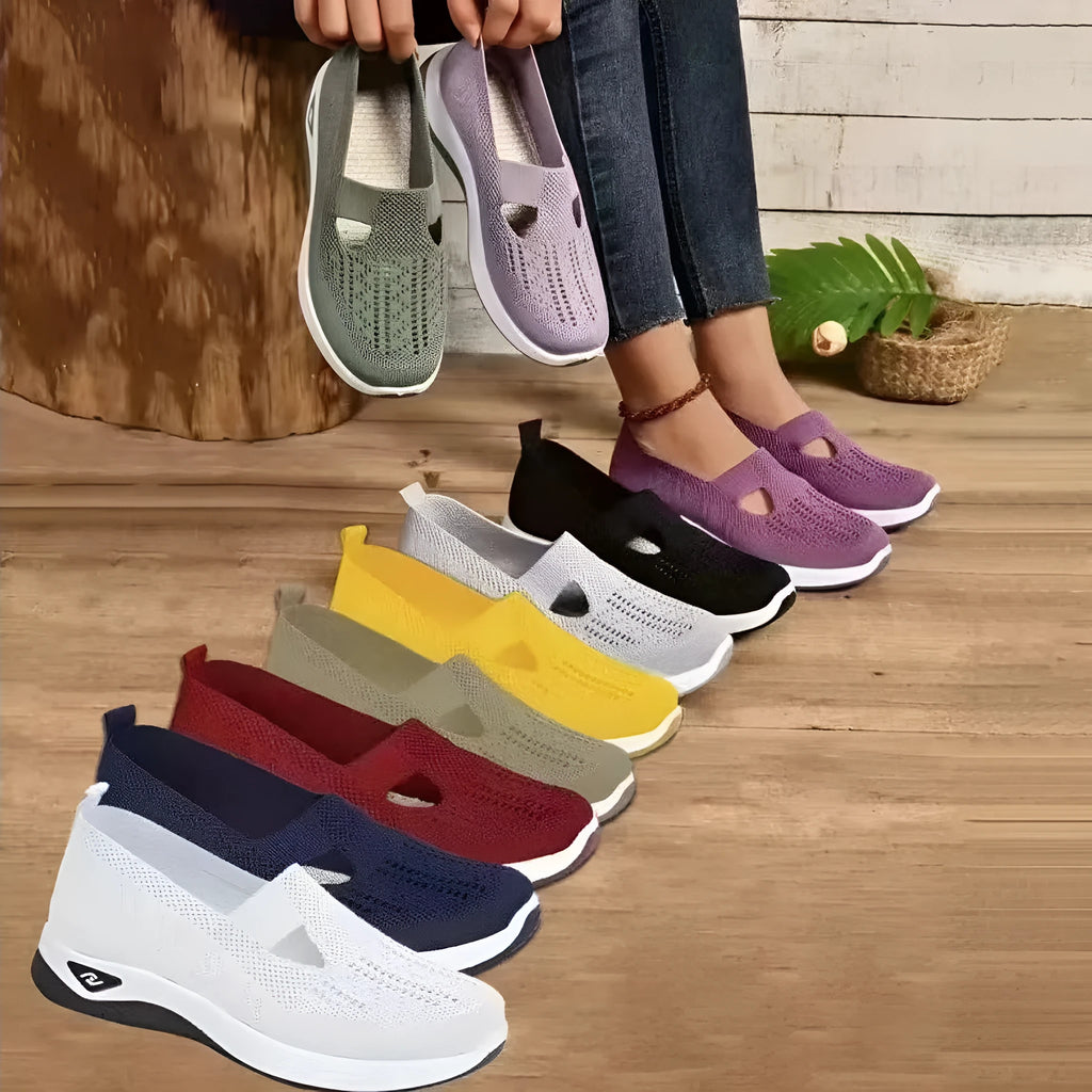 Women's black casual mesh shoes with T-strap and flat soft sole.