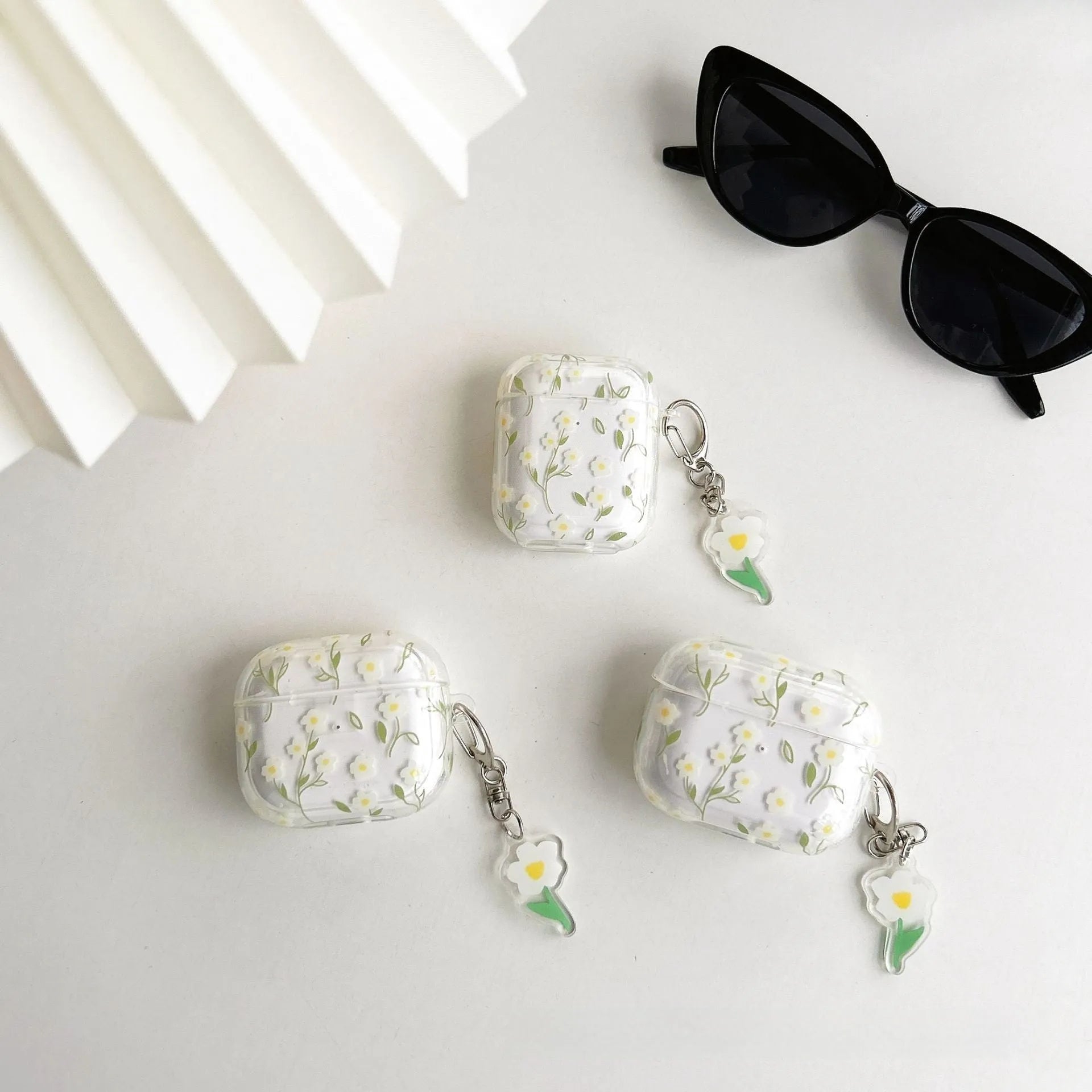Clear TPU protective case with white floral pattern for Apple AirPods charging case