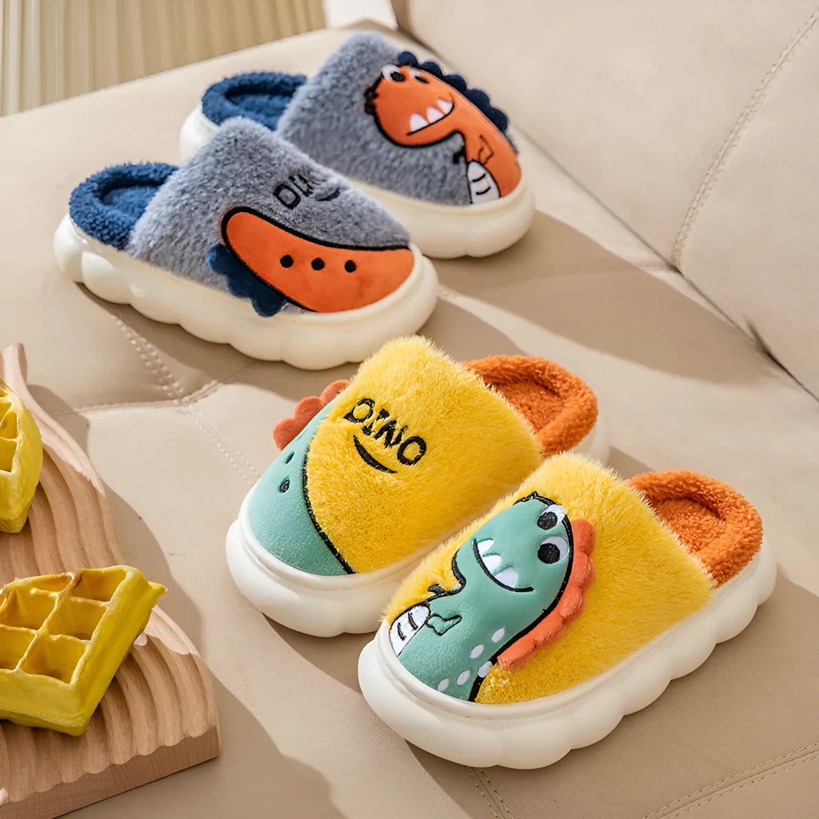Plush cotton couple slippers with dinosaur print in grey, coffee, or orange colours.