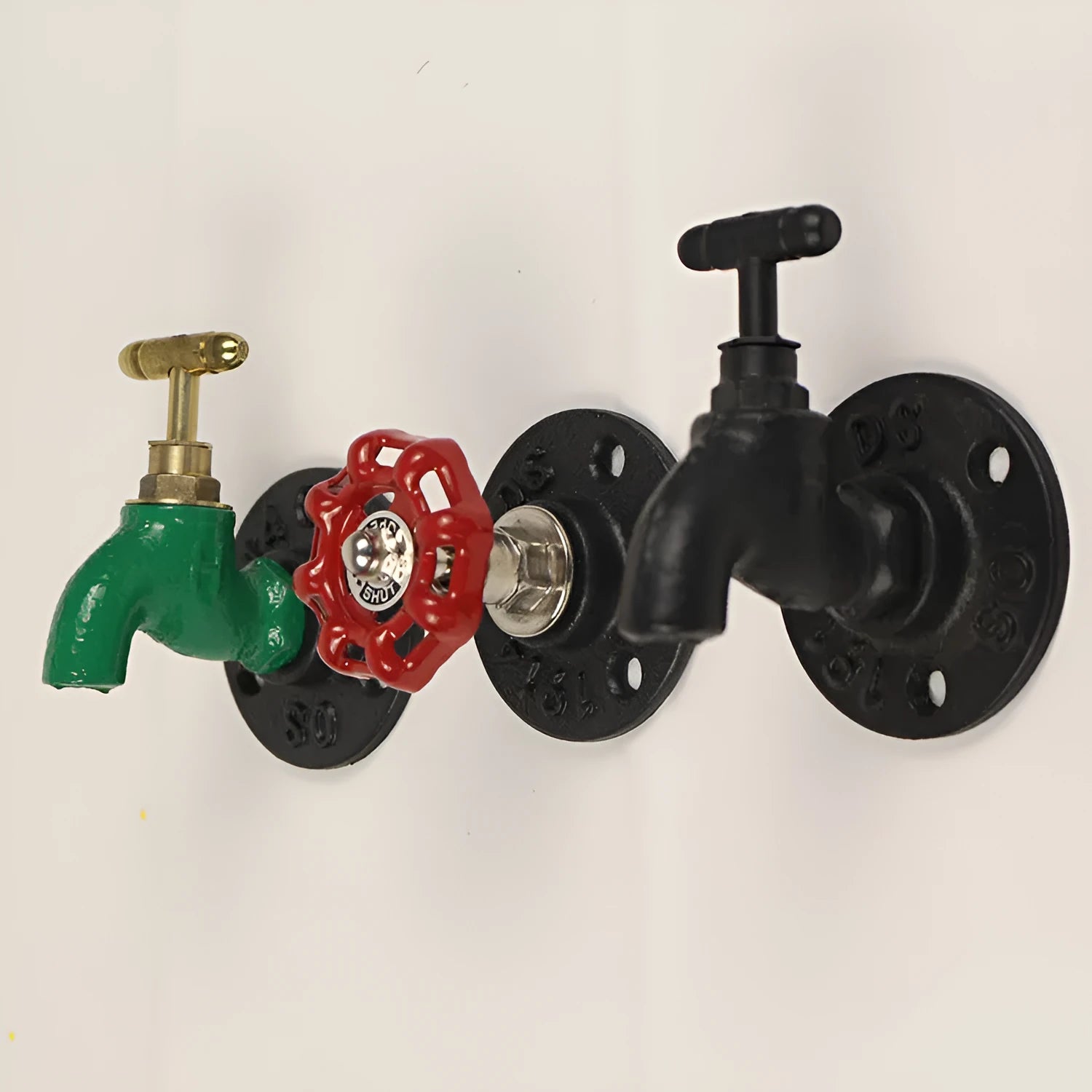 Water pipe style polished metal wall hook for hanging towels and clothes in a choice of three colours.