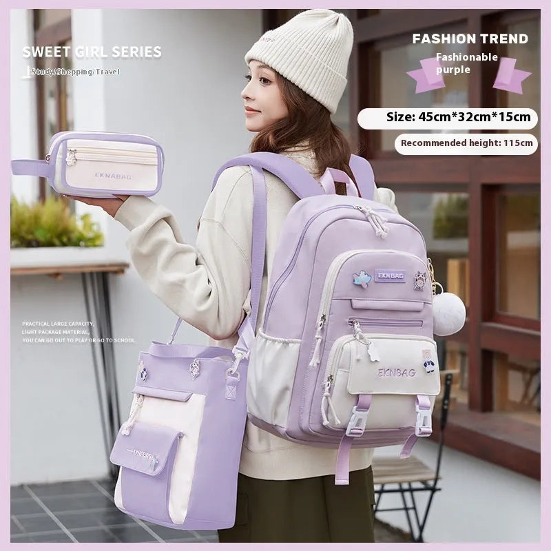 Pink waterproof Oxford cloth school backpack for girls with curved shoulder straps on a white background.