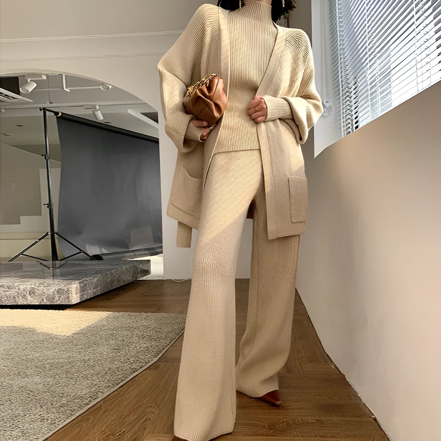 Women's knitted polyester three-piece set with cardigan, sweater, and wide-leg pants featuring leather stitching trim