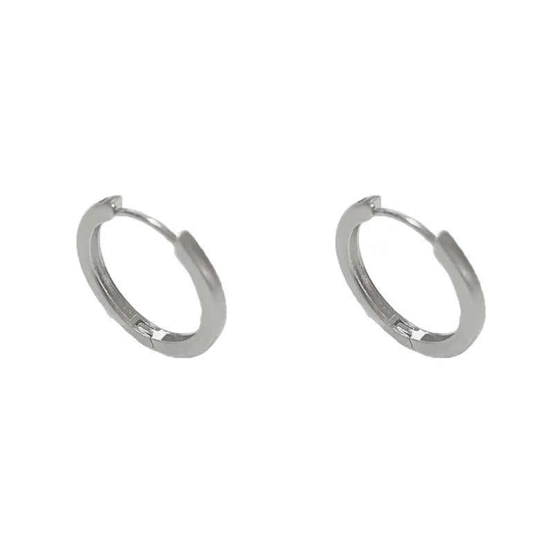 Women's geometric ear clip with round design in gold and silver plated finishes