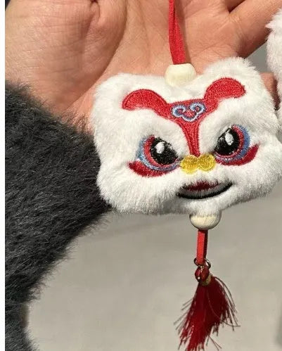 Chinese style blue plush lion keychain ornament with star stone detail and cartoon styling