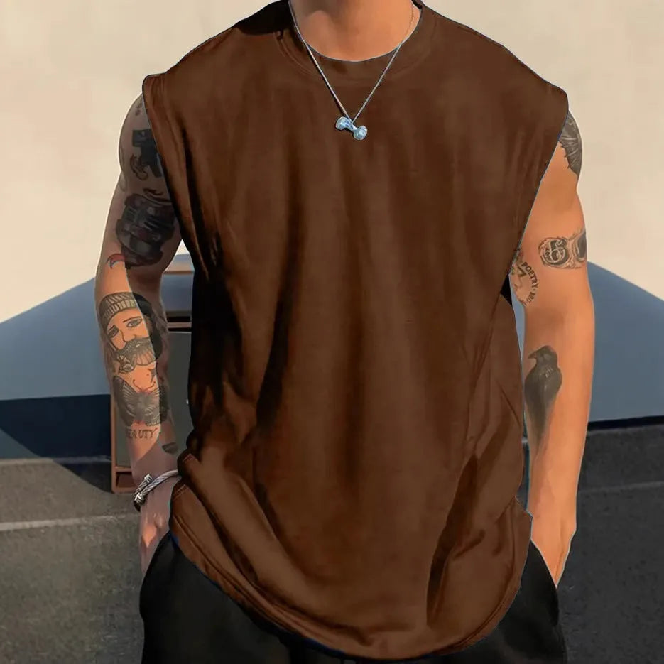 Men's loose solid colour sleeveless cotton tank top on a hanger, shown in a light apricot shade.