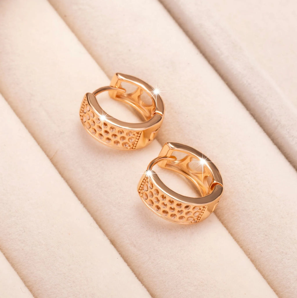 Rose gold hollow heart earrings with circular design and electroplated finish
