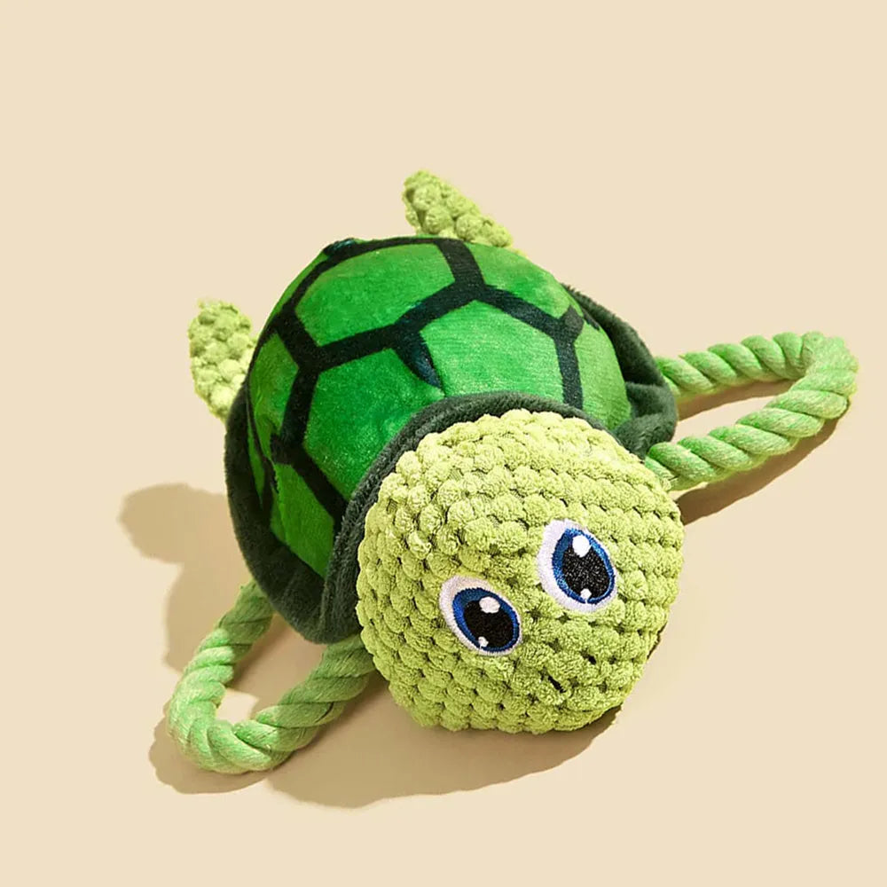 Turtle-shaped dog chewing toy with knotted texture in grey, green, or orange colour