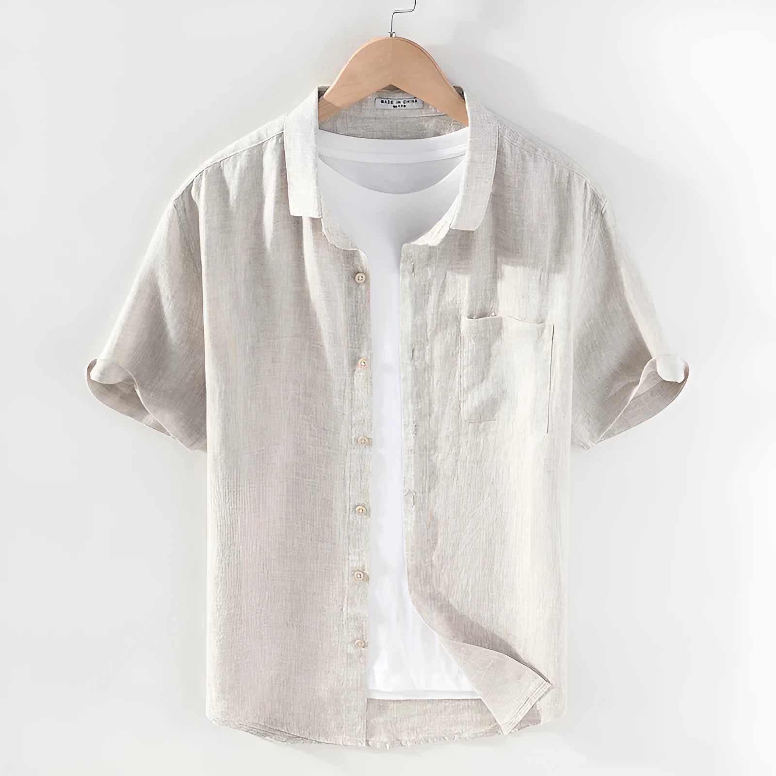 Men's square collar short sleeve linen shirt in raw jute colour on a hanger