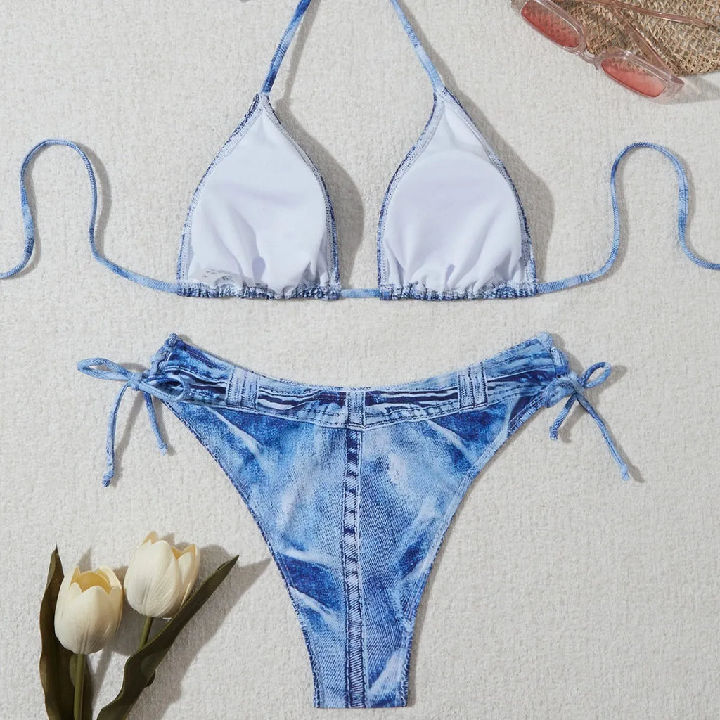 Denim blue printed women's bikini set with strap design on a model, showing front and back.