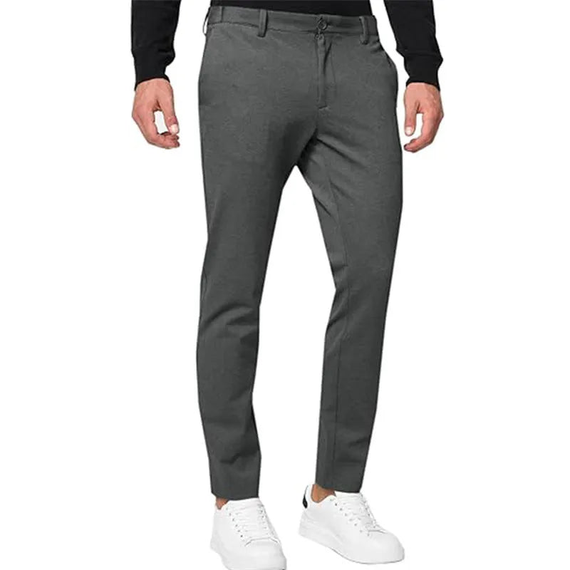 Men's slim-fit tapered chino pants in Army Green colour, showing pleated front and zipper fly detail.
