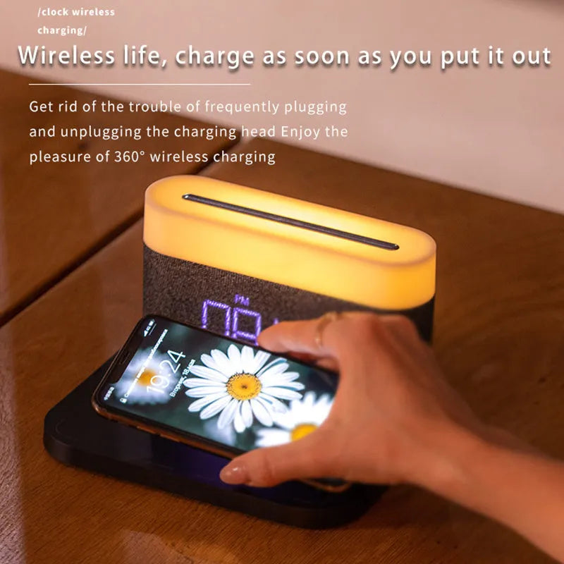 Black and white minimalist wireless charging station with digital clock, night light, and thermal cup.