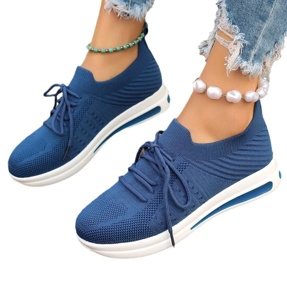 Women's low-top casual sneakers in red, black, or blue with round toe and front lace-up design.