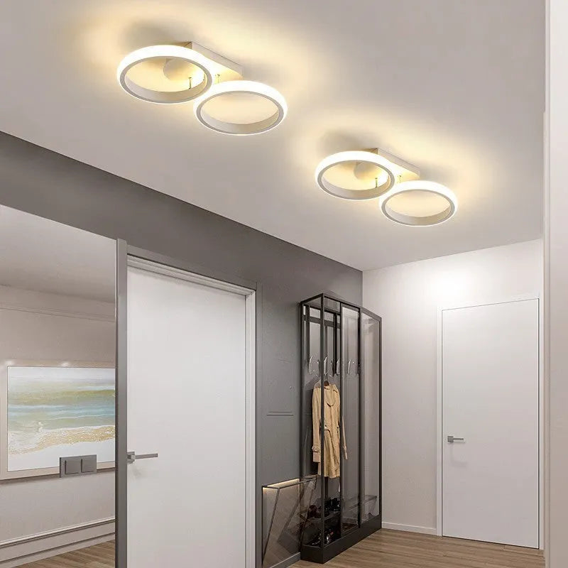 Modern simplicity hallway LED ceiling light in black with three round shapes over a corridor