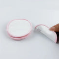 Set of red and blue velvet makeup remover pads next to a cotton mesh storage bag