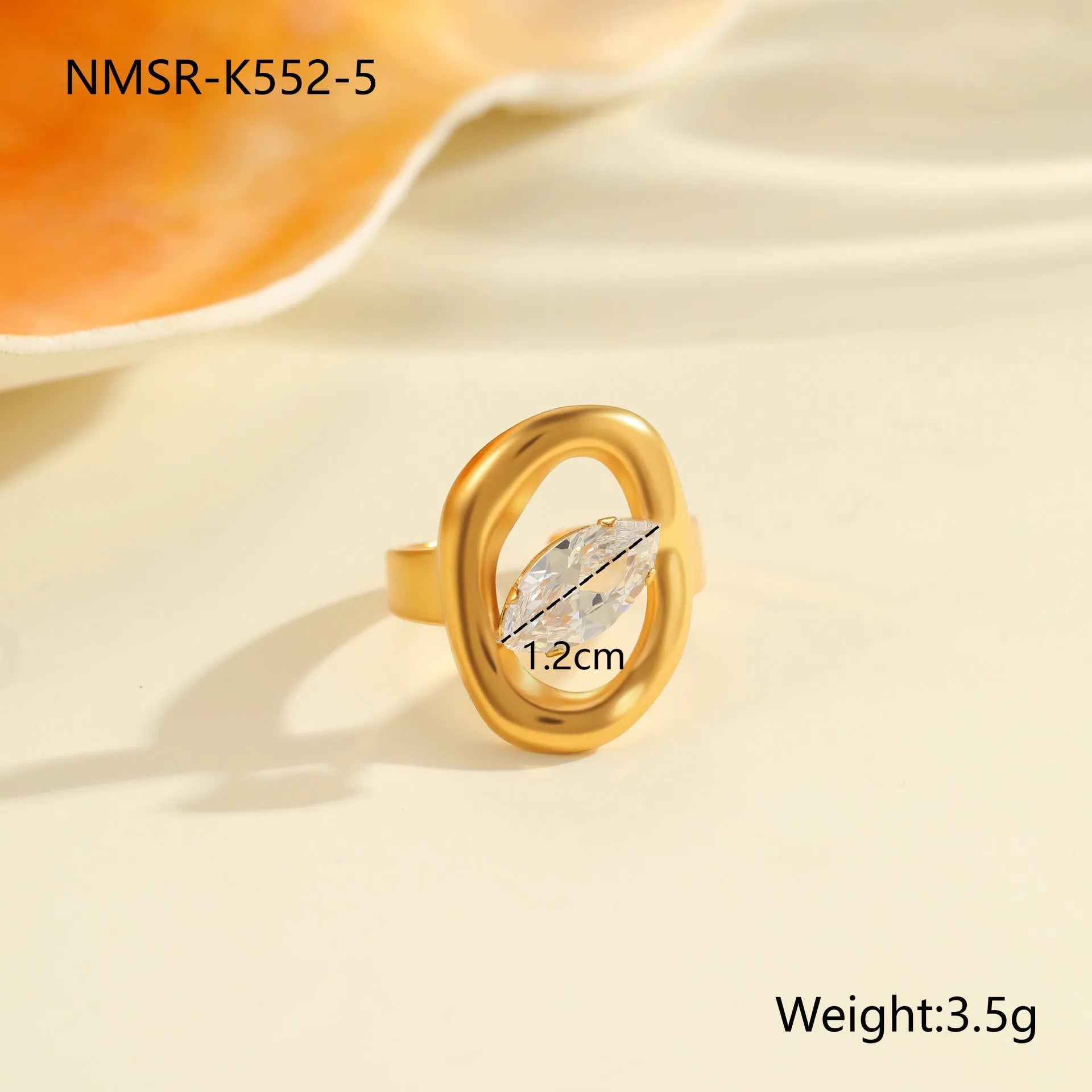 Geometric open mouth stainless steel zircon ring in a free size on a hand.
