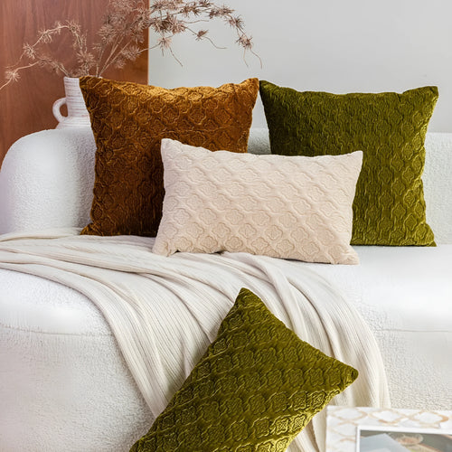 Brown gold antique style three-dimensional quilted cushion pillow on a sofa.