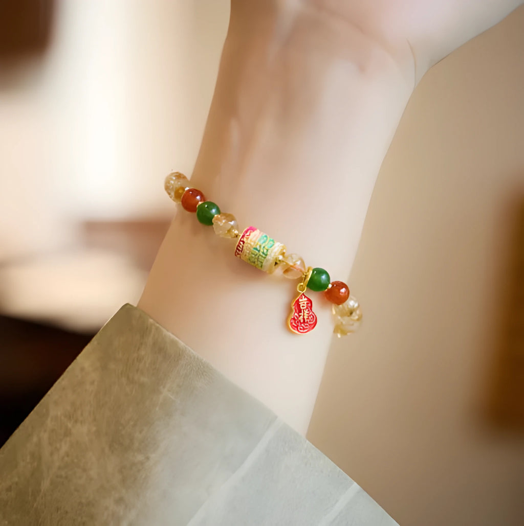 Hand-woven citrine crystal bracelet with five-sutra geometric pattern showing 6mm bead size