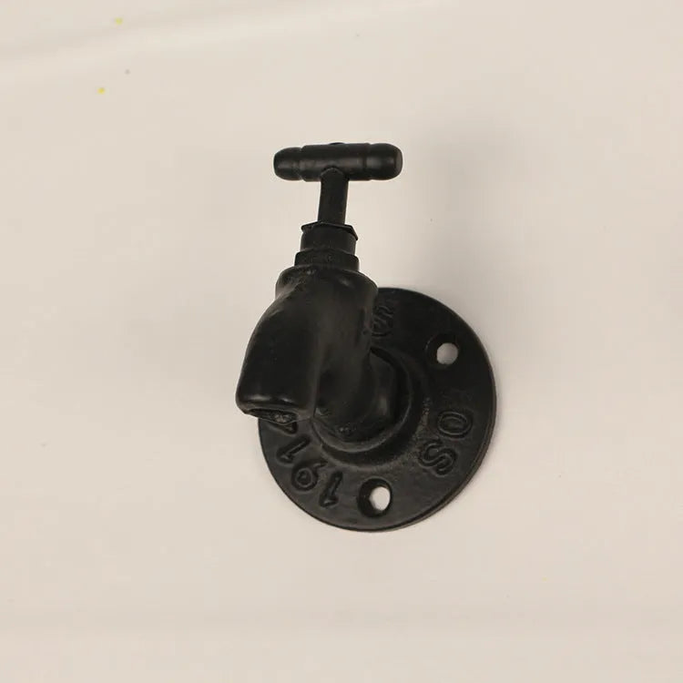 Water pipe style polished metal wall hook for hanging towels and clothes in a choice of three colours.