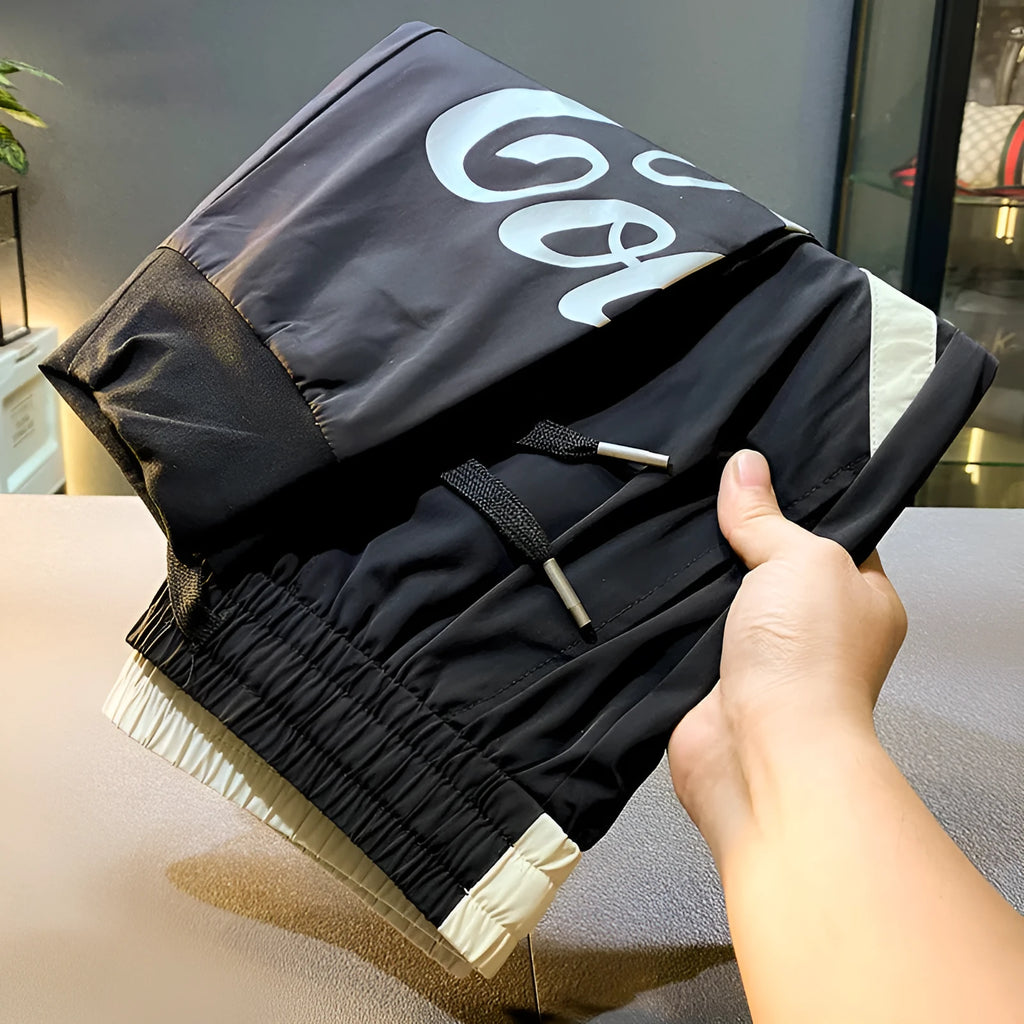 Black men's cropped casual trousers with ankle band made from ultra-thin ice silk cotton fabric.