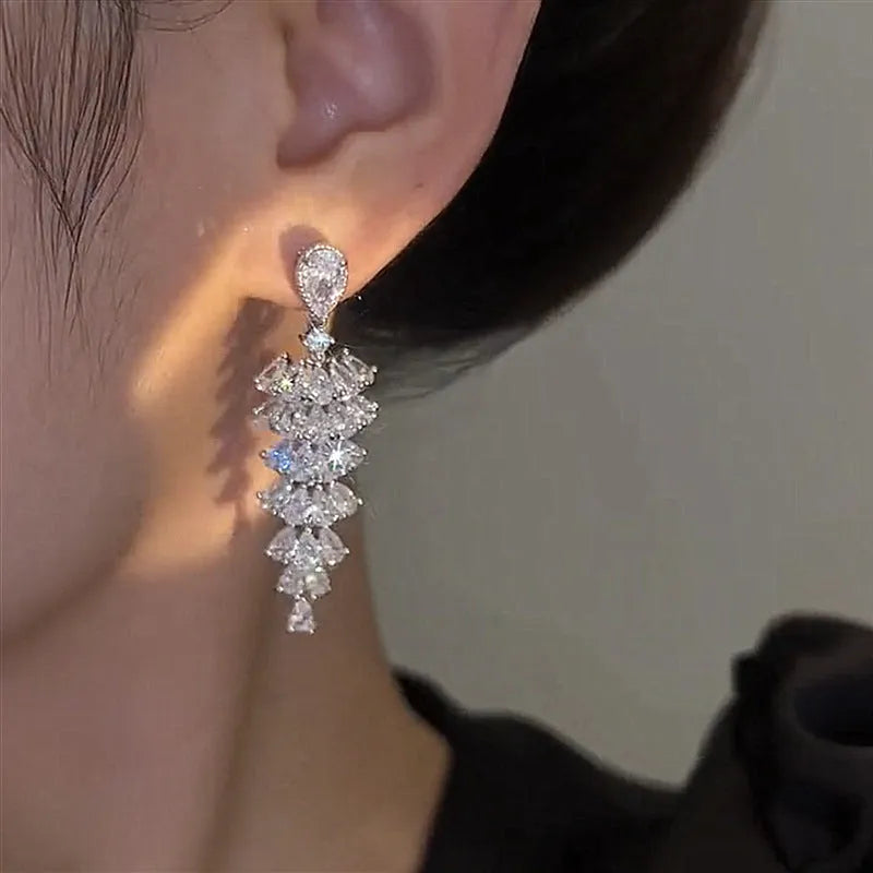 Christmas tree shaped drop earrings with sparkling zircon stones in silver pagoda colour