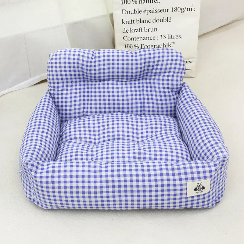 Blue plaid and grey cloth car-mounted pet travel nests shown in small and large sizes