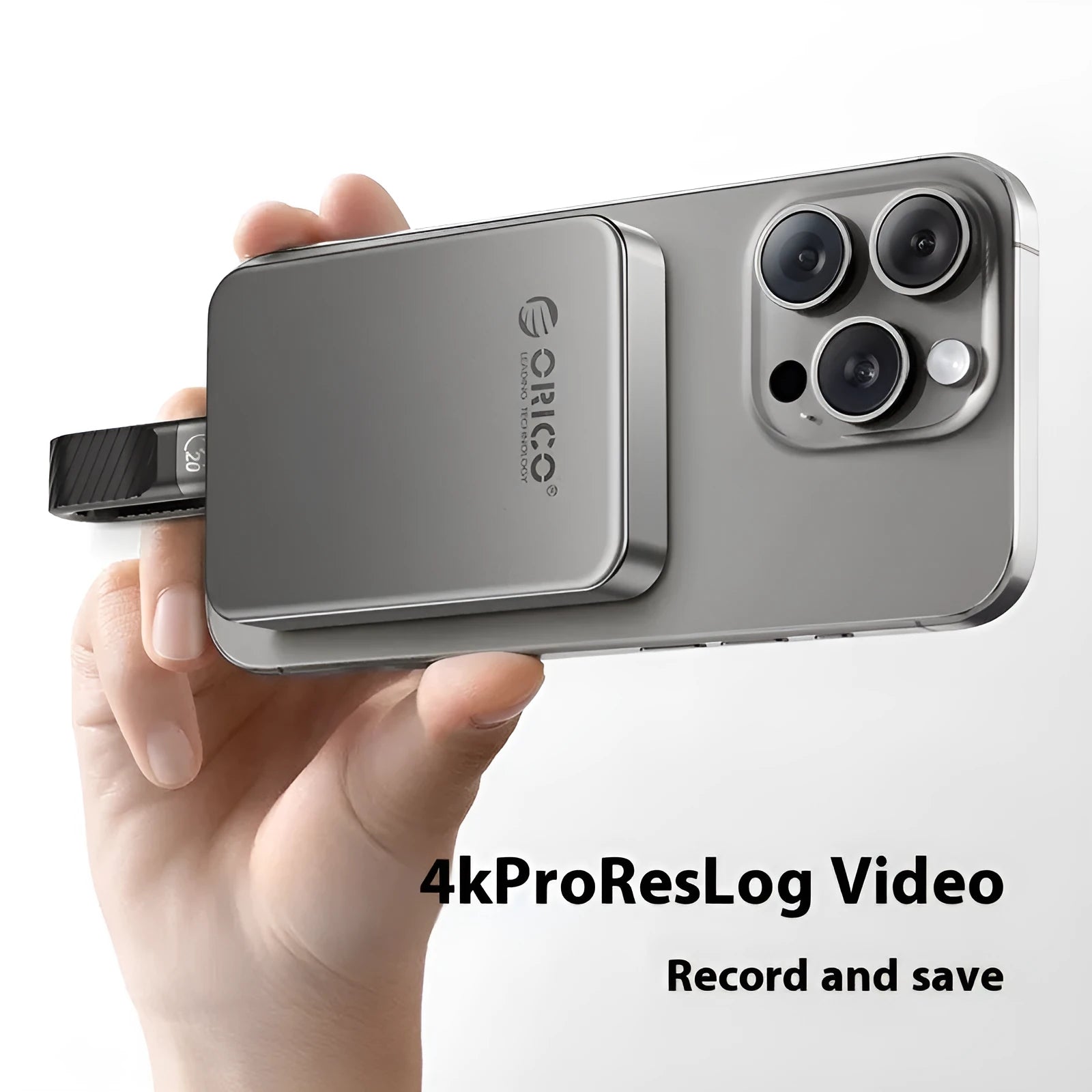 Grey magnetic mobile solid-state drive with suction ring, shown next to a USB-C cable.