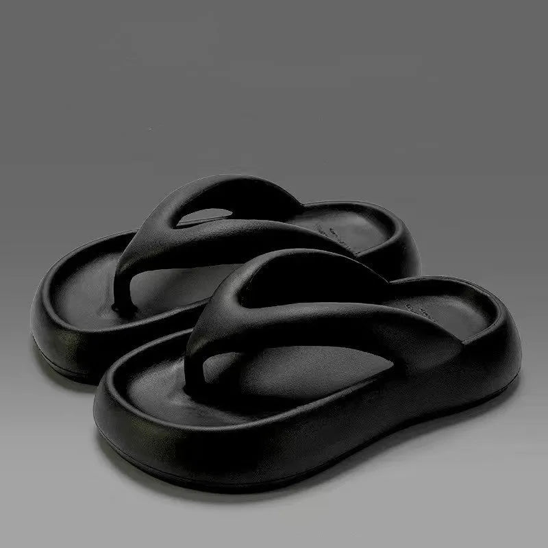 A pair of EVA thick-soled flip-flops with a bow detail on the upper, shown in one of the available colours.