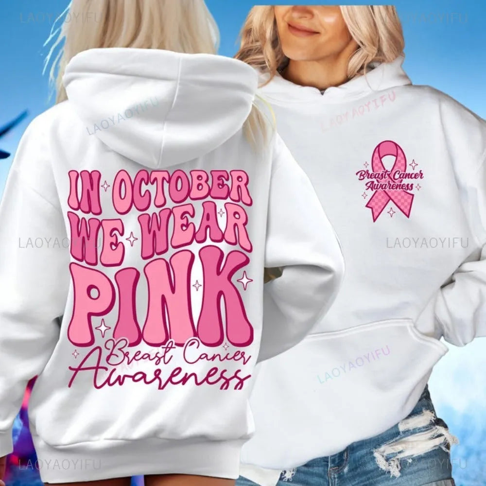 Pink breast cancer awareness pullover hoodie with retro art print and side seam pockets.