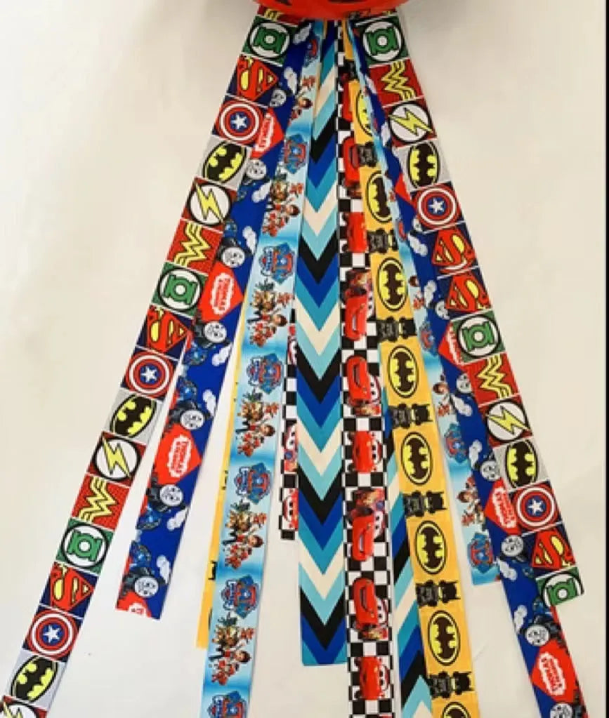 Colourful decorative ribbon streamers attached to a children safety helmet for skating or skiing