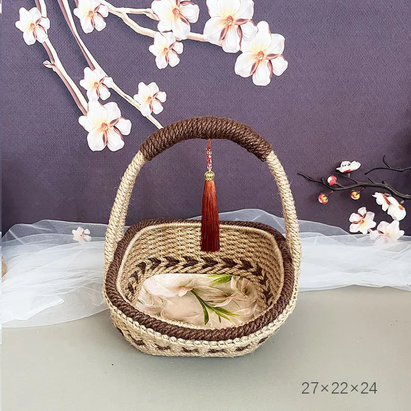 Coffee brown hand-woven straw basket with hemp rope detailing, 19cm long by 12cm wide