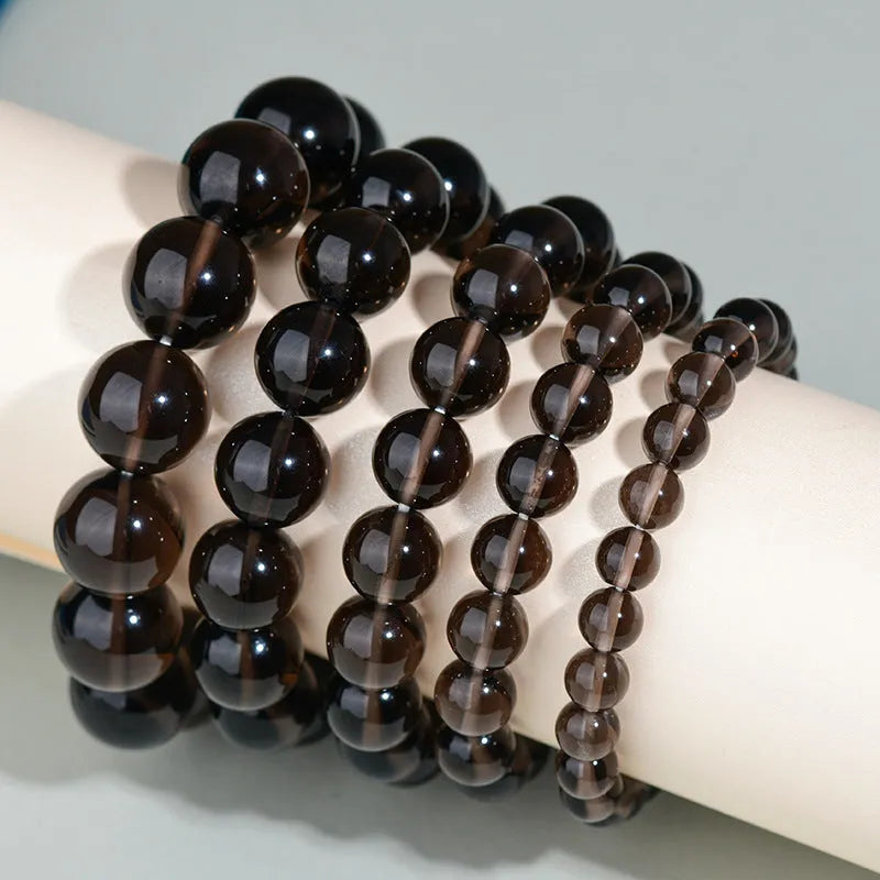 Hand-woven ethnic style unisex obsidian bracelet with round crystal beads.