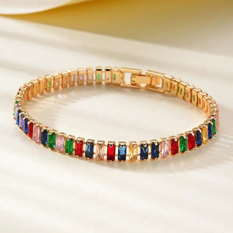 Unisex gold electroplated double-row diamond zirconia tennis chain bracelet on white background