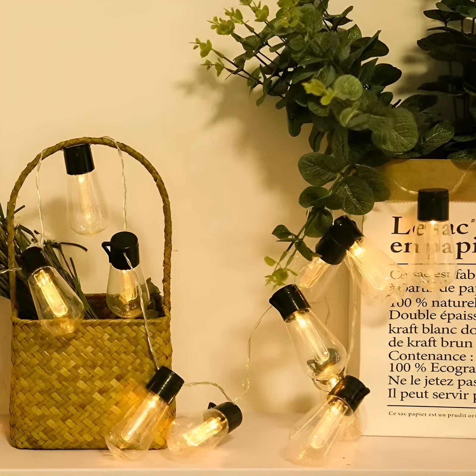 Retro infusion bottle shaped bulb outdoor string lights draped in garden setting
