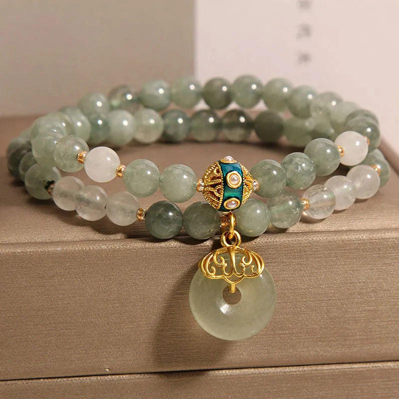 Women's double-layer aventurine jade bracelet with peace buckle closure in emerald green