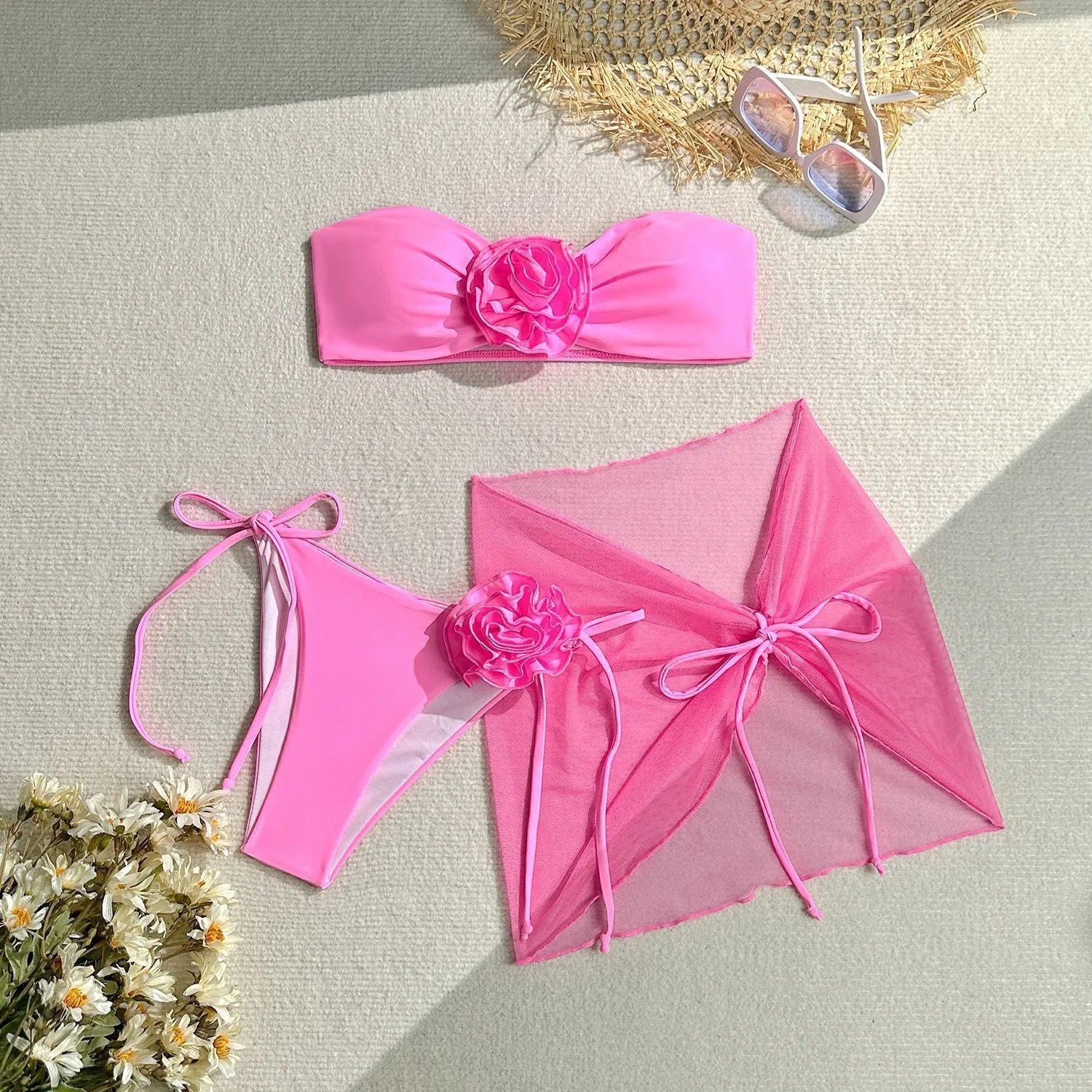 Women's pink floral tube top swimsuit set with matching skirt on mannequin