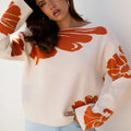 Beige bold flower pattern wide sleeve baggy sweater on display showing loose fit and floral print