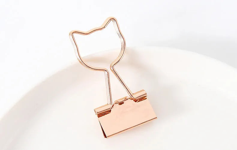 Gold metal decorative paper clip with long tail design in various shapes including flamingo, love and cat