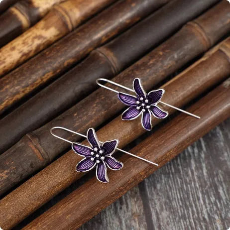 Purple flower-shaped alloy stud earrings with electroplated finish