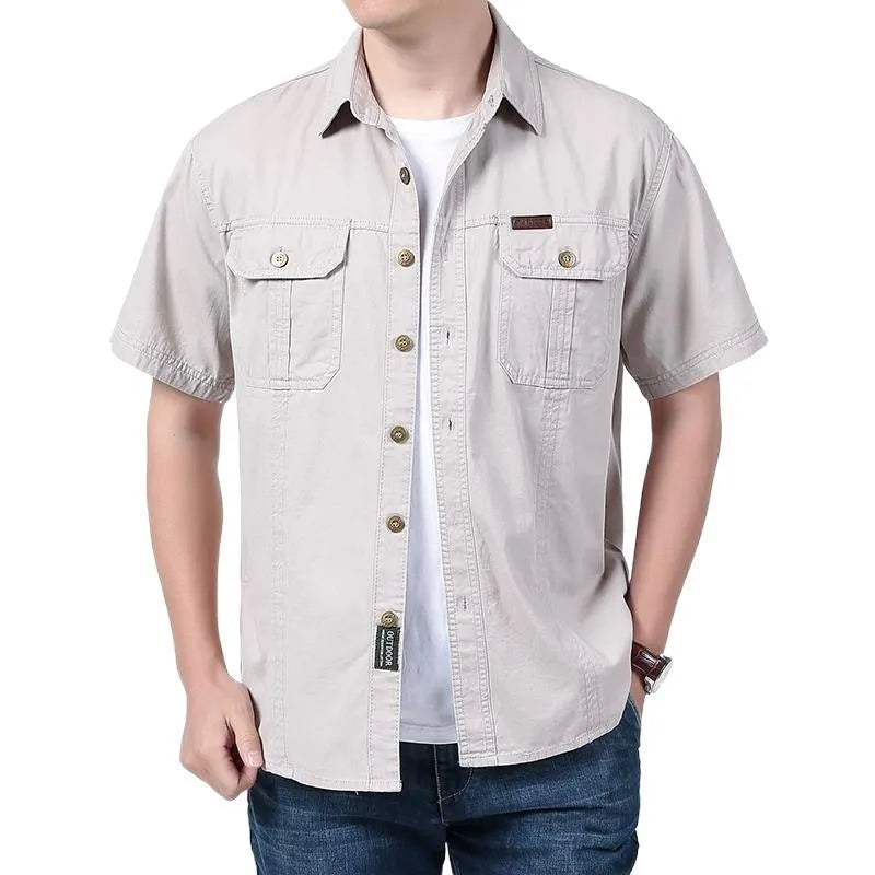 Men's cotton short sleeve loose fit cardigan shirt in dark blue on a model, summer workwear style
