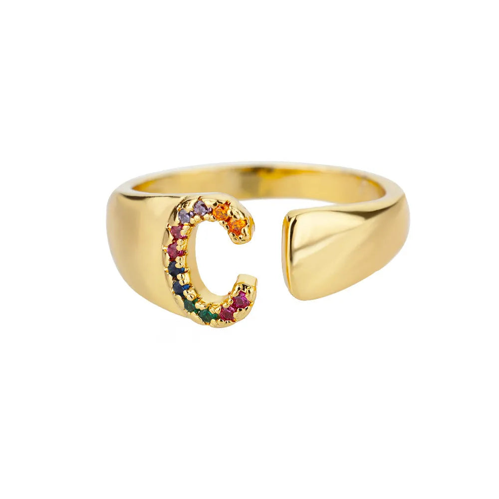 Fashion micro-set colored zirconium adjustable open ring showing letter A on a copper electroplated base