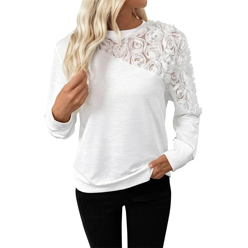White long sleeve top with floral pattern in loose fit pullover style