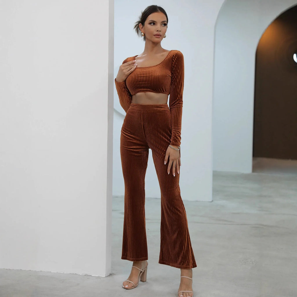 Caramel coloured long sleeve sweater and matching trousers lounge set on a hanger