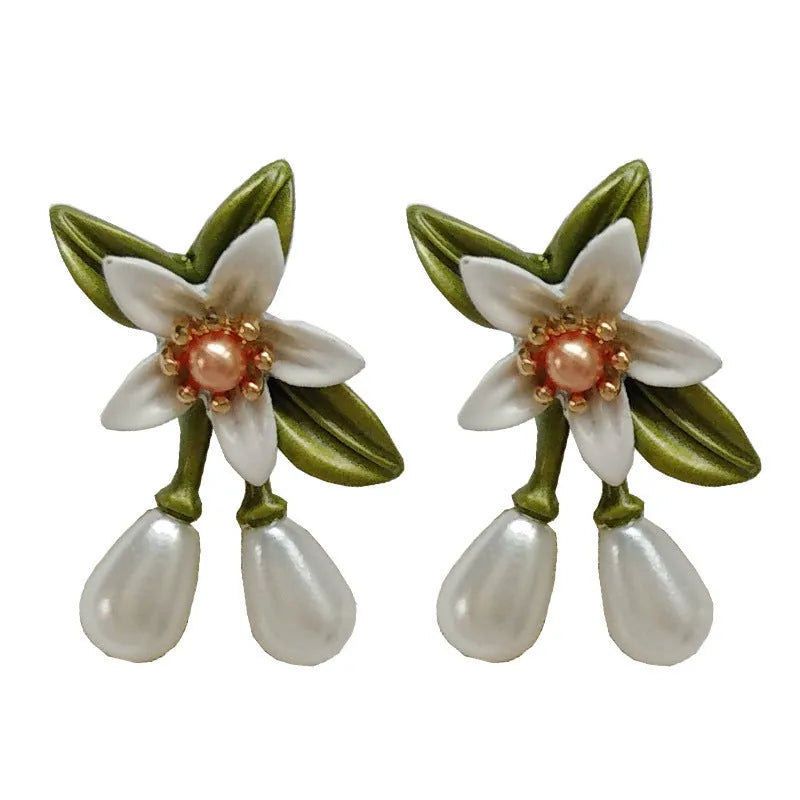 Women's alloy flower earrings with sterling silver needle camellia design and contrast colour styling