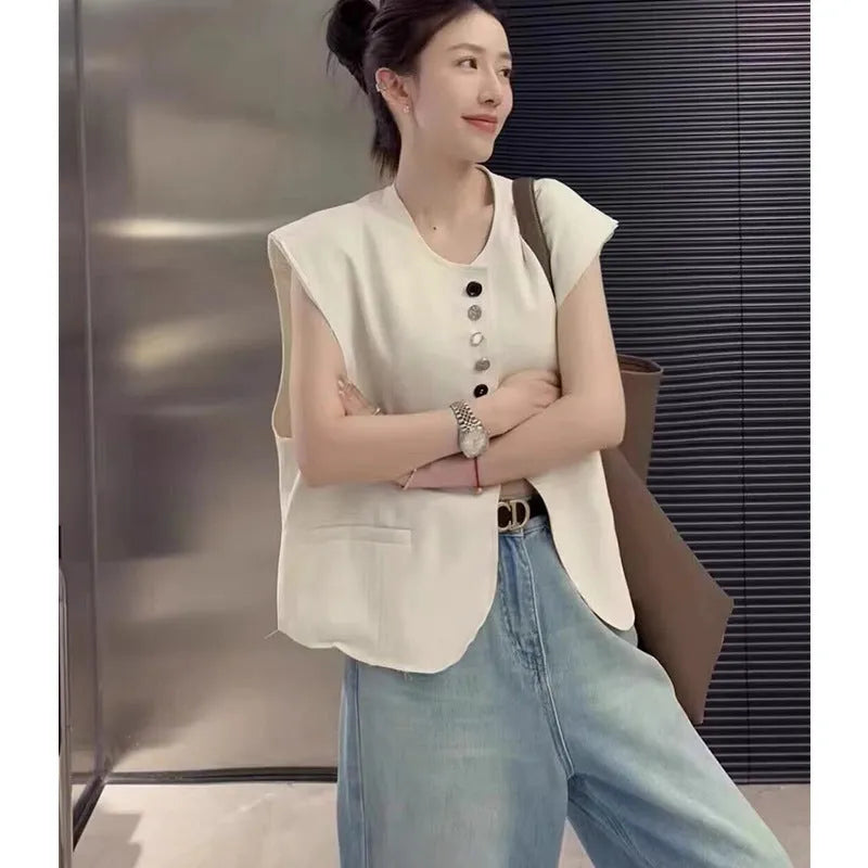Women's polyester vest in milky white with pocket detail and loose fit design