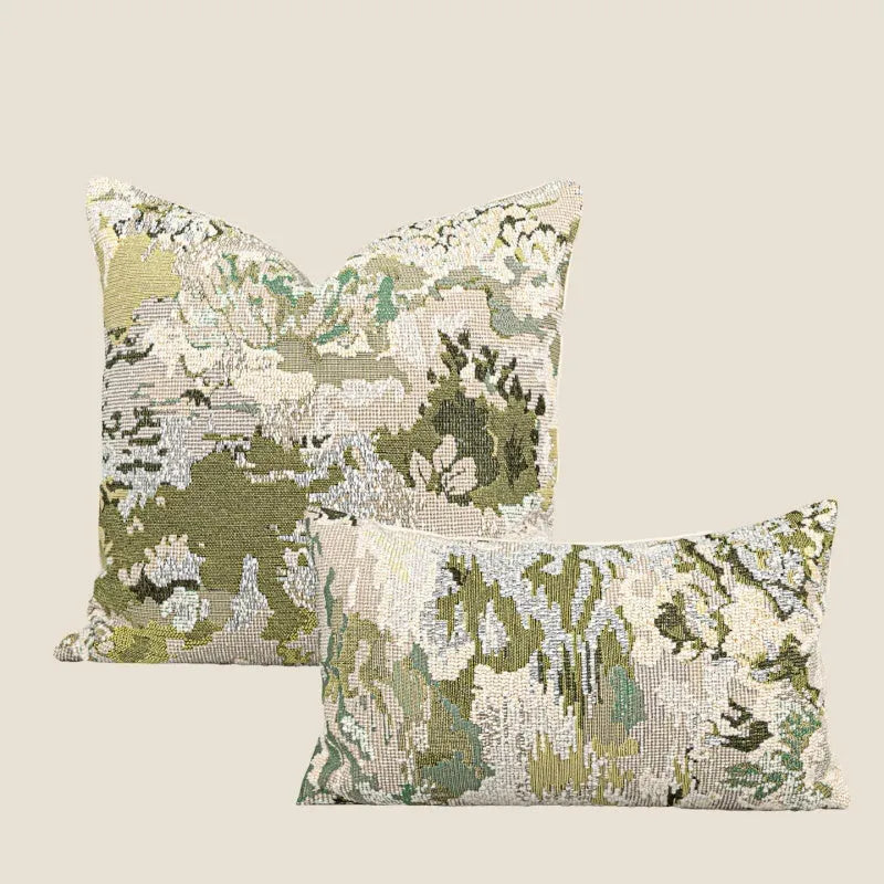 Antique green wool blend cushion with abstract spring flowers pattern, shown in square and lumbar sizes.