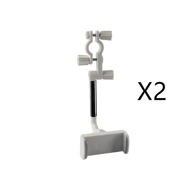 Black ABS plastic mobile phone bracket mounted on car rearview mirror holding smartphone