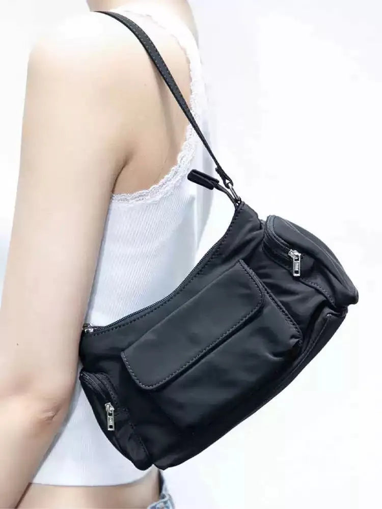 Black lightweight women's shoulder bag with double pockets and side line detailing