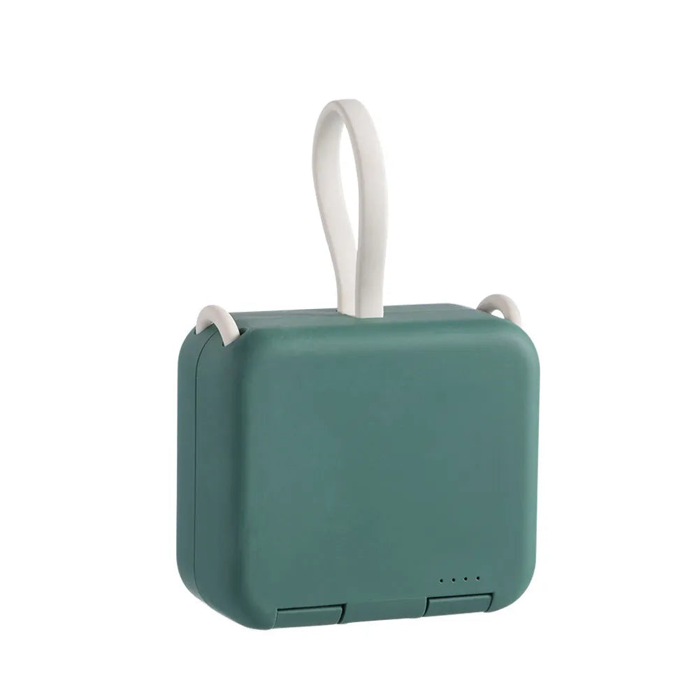 Handbag back clip power bank in blue, showing clip detail and phone standing in its holder mode.