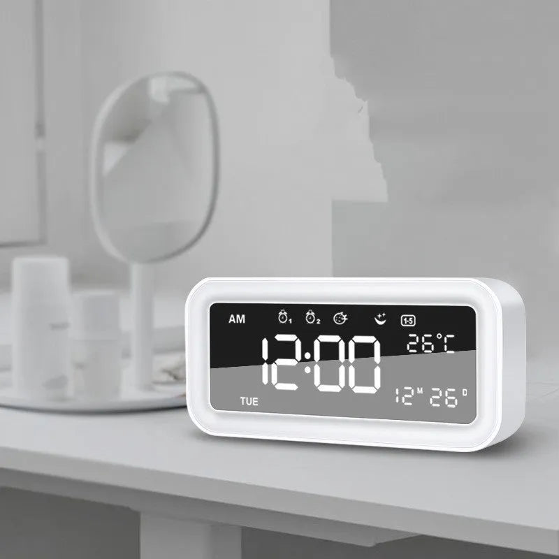 Blue rectangular LED atmosphere light alarm clock with digital display on wooden surface