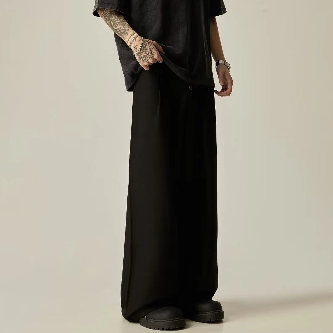 Men's black wide-leg casual trousers with elasticated mid waist and button fly in polyester-cotton blend fabric